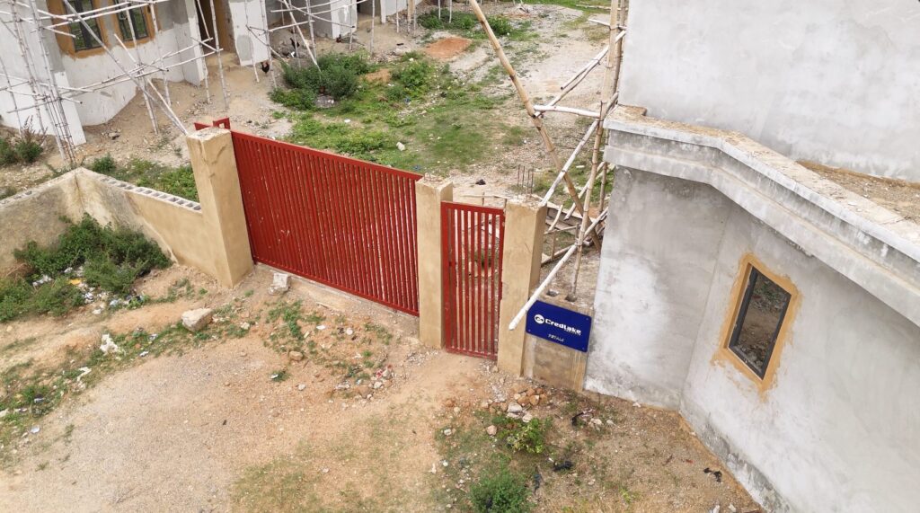Petals, Life Camp: estate gate and security house